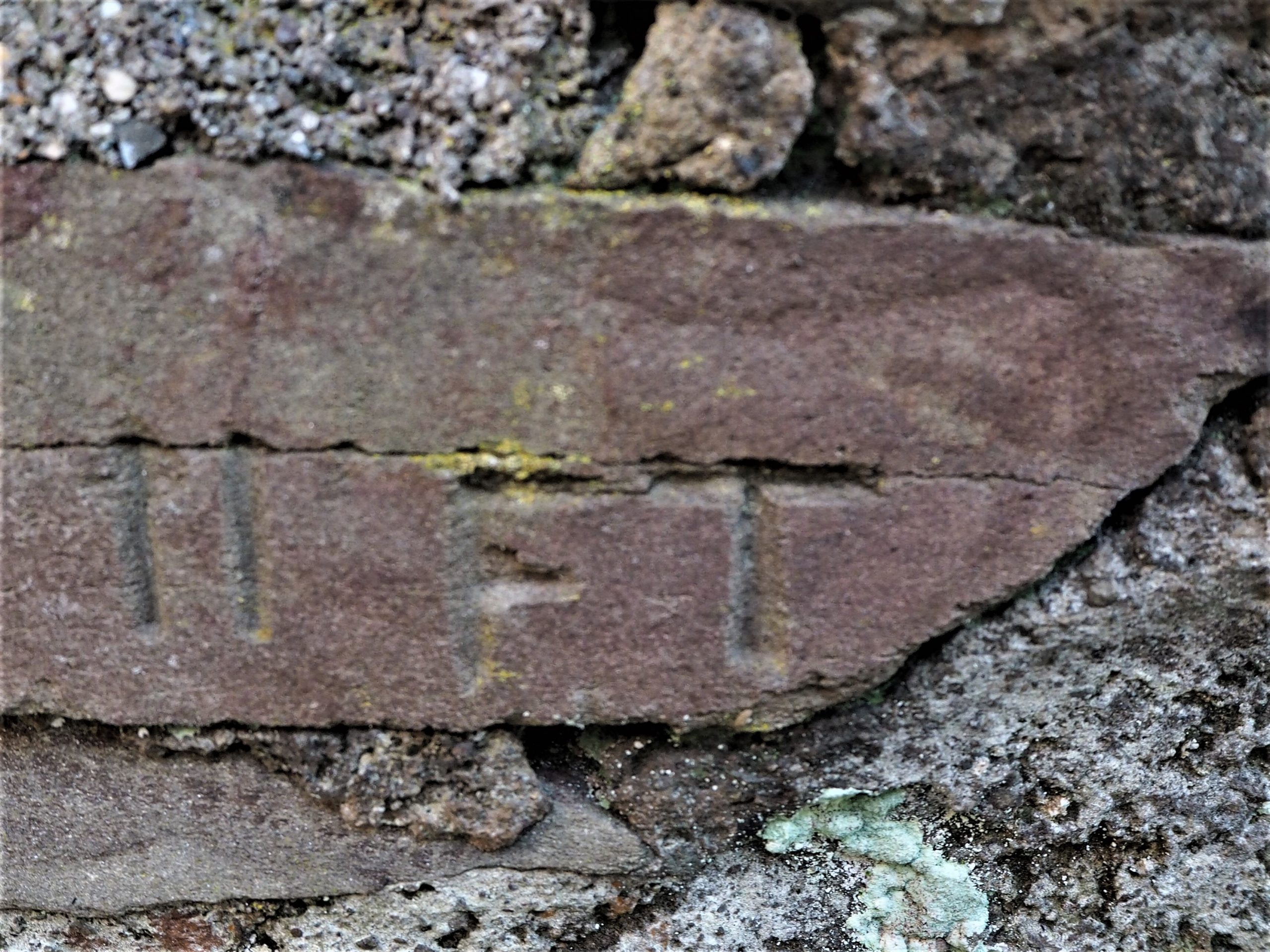 100 Objects 25: “11 ft” inscribed on a stone